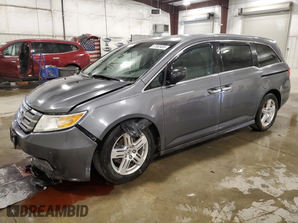 2012 Honda Odyssey Touring with VIN 5FNRL5H98CB028309, listed as a Copart auction lot 57663485 with 233,921 mi miles and Salvage title. Bid and sale history available at DreamBid. Image 1.