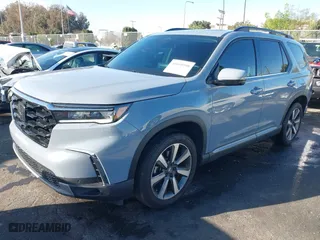 2024 Honda Pilot Touring with VIN 5FNYG1H74RB020112, listed as a IAAI auction lot 41698998 with 11,612 mi miles. Bid and sale history available at carsss.com. Image 2.