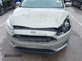 2016 Ford Focus SE z VIN 1FADP3F26GL332224, wystawiony jako IAAI lot #42167222 z przebiegiem 134 423 mil mil oraz . Historia ofert i sprzedaży dostępna na DreamBid. Obrazek 6.
