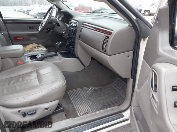 2002 Jeep Grand Cherokee Limited with VIN 1J8GX58N42C283956, listed as a IAAI auction lot 41553997 with 214,388 mi miles and . Bid and sale history available at DreamBid. Image 5.