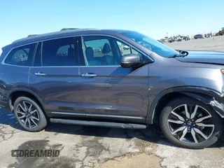 2021 Honda Pilot Touring 8-Passenger with VIN 5FNYF6H97MB034399, listed as a IAAI auction lot 42303419 with 50,034 mi miles and . Bid and sale history available at DreamBid. Image 14.