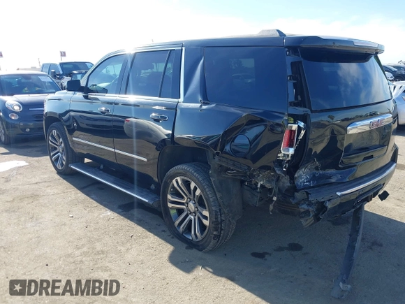 2019 GMC Yukon Denali with VIN 1GKS2CKJ4KR191886, listed as a IAAI auction lot 41198227 with 74,325 mi miles. Bid and sale history available at carsss.com. Image 3.