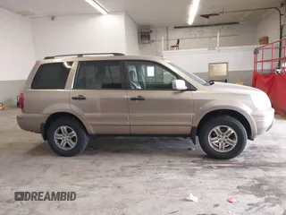 2005 Honda Pilot EX-L with VIN 5FNYF18565B019345, listed as a IAAI auction lot 41641423 with 282,099 mi miles. Bid and sale history available at carsss.com. Image 13.