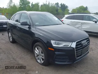 2017 Audi Q3 Premium Plus z VIN WA1JCCFS2HR002405, wystawiony jako IAAI lot #42240959 z przebiegiem 119 171 mil mil oraz . Historia ofert i sprzedaży dostępna na DreamBid. Obrazek 1.