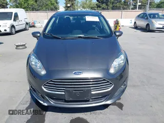 2019 Ford Fiesta SE z VIN 3FADP4BJ2KM131012, wystawiony jako IAAI lot #42228822 z przebiegiem 100 460 mil mil oraz . Historia ofert i sprzedaży dostępna na DreamBid. Obrazek 12.