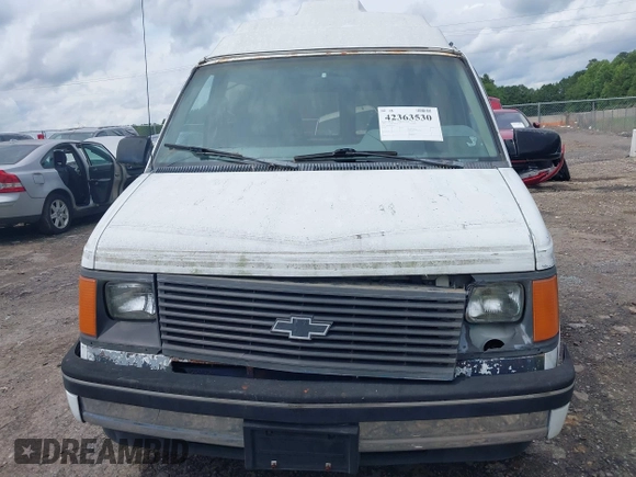 1991 Chevrolet Astro Cargo z VIN 1GBDM19Z7MB202913, wystawiony jako IAAI lot #42363530 z przebiegiem 191 695 mil mil oraz . Historia ofert i sprzedaży dostępna na DreamBid. Obrazek 6.