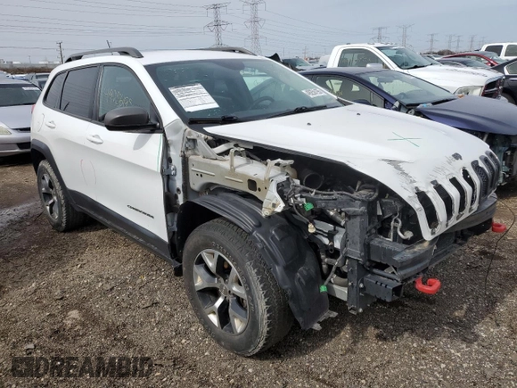 2015 Jeep Cherokee Trailhawk with VIN 1C4PJMBS9FW605075, listed as a Copart auction lot 49256195 with 103,677 mi miles and Salvage Title. Bid and sale history available at DreamBid. Image 4.