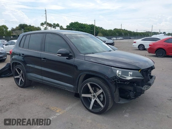2014 Volkswagen Tiguan SE z VIN WVGAV3AXXEW535128, wystawiony jako IAAI lot #41882213 z przebiegiem 103 161 mil mil oraz . Historia ofert i sprzedaży dostępna na DreamBid. Obrazek 1.