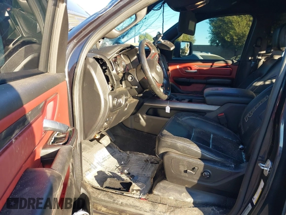 2019 Ram 1500 Rebel z VIN 1C6SRFLT2KN900600, wystawiony jako IAAI lot #41307832 z przebiegiem 74 481 mil mil oraz . Historia ofert i sprzedaży dostępna na DreamBid. Obrazek 5.