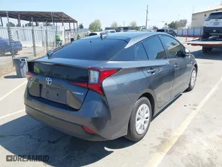 2022 Toyota Prius L Eco with VIN JTDKAMFU5N3160694, listed as a IAAI auction lot 41874909 with 80,376 mi miles. Bid and sale history available at carsss.com. Image 4.