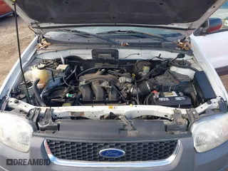 2003 Ford Escape XLT Popular 2 with VIN 1FMCU93163KB78008, listed as a IAAI auction lot 41660779 with 153,898 mi miles. Bid and sale history available at carsss.com. Image 10.