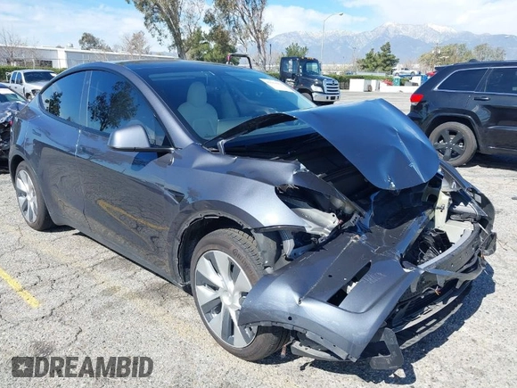 2022 Tesla Model Y Long Range with VIN 7SAYGAEEXNF381389, listed as a IAAI auction lot 41613075 with 52,800 mi miles and . Bid and sale history available at carsss.com. Image 1.