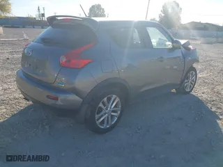 2013 Nissan Juke SV with VIN JN8AF5MV6DT214876, listed as a IAAI auction lot 40699579 with 119,920 mi miles. Bid and sale history available at carsss.com. Image 4.