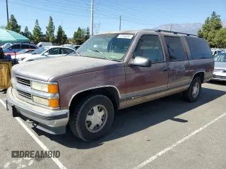 1997 Chevrolet Suburban with VIN 1GNEC16R4VJ418725, listed as a Copart auction lot 75766084 with 216,722 mi miles and Salvage Title. Bid and sale history available at carsss.com. Image 1.