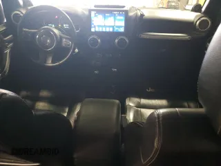 2012 Jeep Wrangler Unlimited Sahara with VIN 1C4BJWEG8CL235893, listed as a Copart auction lot 58195585 with 142,179 mi miles and Salvage title. Bid and sale history available at DreamBid. Image 8.