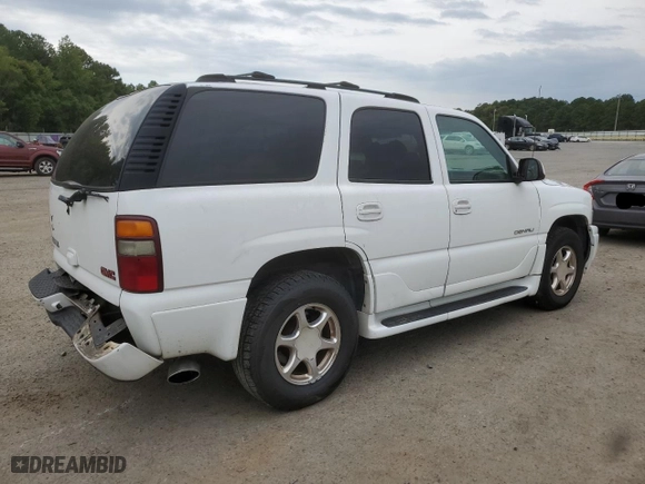 2001 GMC Yukon Denali with VIN 1GKEK63U31J261351, listed as a Copart auction lot 72768274 with 258,596 mi miles and Salvage Title. Bid and sale history available at carsss.com. Image 3.