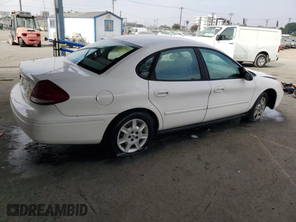2006 Ford Taurus SE with VIN 1FAHP53U86A237001, listed as a Copart auction lot 62858785 with 133,697 mi miles and Salvage title. Bid and sale history available at DreamBid. Image 3.