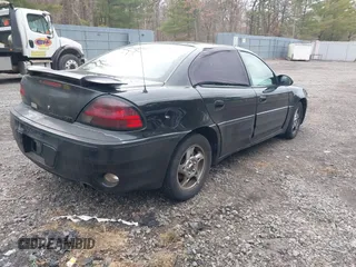 2004 Pontiac Grand Am GT with VIN 1G2NW52E84M651292, listed as a IAAI auction lot 41726143 with 137,296 mi miles. Bid and sale history available at carsss.com. Image 4.