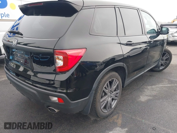 2021 Honda Passport EX-L with VIN 5FNYF7H5XMB013923, listed as a IAAI auction lot 41669295 with 42,969 mi miles. Bid and sale history available at carsss.com. Image 4.