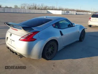 2014 Nissan 370Z Nismo with VIN JN1AZ4EH4EM634236, listed as a IAAI auction lot 41256664 with 80,294 mi miles and . Bid and sale history available at DreamBid. Image 4.