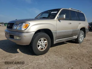 2000 Lexus LX 470 with VIN JT6HT00W1Y0104773, listed as a Copart auction lot 86872624 with 193,283 mi miles and Salvage Title. Bid and sale history available at DreamBid. Image 1.