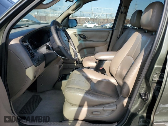 2002 Mazda Tribute LX with VIN 4F2YU08112KM16716, listed as a Copart auction lot 55095645 with 113,885 mi miles and Salvage Title. Bid and sale history available at DreamBid. Image 7.