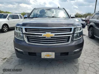 2015 Chevrolet Suburban LTZ with VIN 1GNSCKKCXFR216890, listed as a Copart auction lot 52695155 with 233,296 mi miles and Clean Title. Bid and sale history available at carsss.com. Image 5.