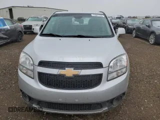 2012 Chevrolet Orlando 1LT z VIN KL77P2EM1CK550055, wystawiony jako Copart lot #77021754 z przebiegiem 127 987 mil mil oraz Szkody całkowita. Historia ofert i sprzedaży dostępna na DreamBid. Obrazek 5.