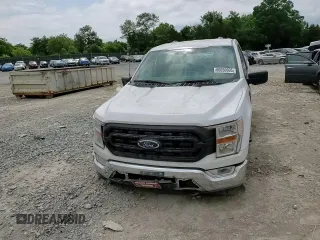 2021 Ford F-150 XL with VIN 1FTMF1EP7MKE72931, listed as a Copart auction lot 60650605 with 23,825 mi miles and Salvage title. Bid and sale history available at DreamBid. Image 13.