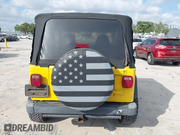 2002 Jeep Wrangler X z VIN 1J4FA39S82P719241, wystawiony jako IAAI lot #42150742 z przebiegiem 147 914 mil mil oraz . Historia ofert i sprzedaży dostępna na DreamBid. Obrazek 16.