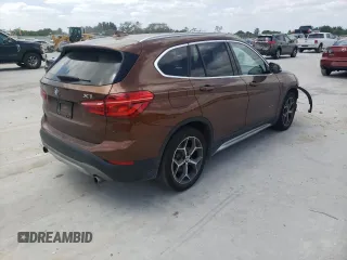 2016 BMW X1 xDrive28i with VIN WBXHT3C31GP880132, listed as a Copart auction lot 69129132 with 74,759 mi miles. Bid and sale history available at carsss.com. Image 4.