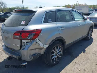 2014 Mazda CX-9 Grand Touring z VIN JM3TB3DV4E0429428, wystawiony jako IAAI lot #42094028 z przebiegiem 147 294 mil mil oraz . Historia ofert i sprzedaży dostępna na DreamBid. Obrazek 4.
