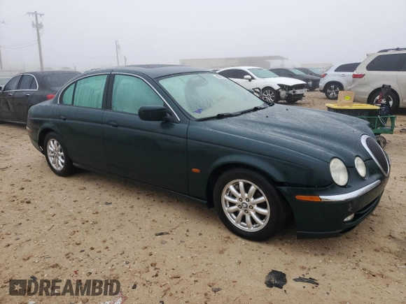 2002 Jaguar S-Type with VIN SAJDA01P12GM27242, listed as a Copart auction lot 88579215 with 218,546 mi miles and Salvage Title. Bid and sale history available at DreamBid. Image 4.