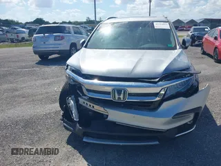 2021 Honda Pilot Touring 8-Passenger with VIN 5FNYF5H99MB041638, listed as a IAAI auction lot 42112915 with 33,230 mi miles and . Bid and sale history available at DreamBid. Image 12.