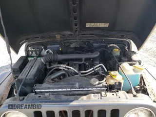 2002 Jeep Wrangler Sport с VIN 1J4FA49S02P734712, выставлен на аукционе Copart как лот 63310225 с пробегом 178 367 миль миль и Чистый • Clean title. История ставок и продаж доступна на DreamBid. Изображение 12.