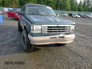 1992 Ford Explorer Eddie Bauer with VIN 1FMDU34X1NUB84827, listed as a Copart auction lot 86973574 with 73,452 mi miles and Salvage title. Bid and sale history available at DreamBid. Image 12.