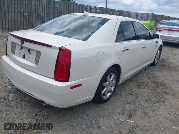 2010 Cadillac STS AWD z VIN 1G6DU6EV4A0102872, wystawiony jako IAAI lot #42348505 z przebiegiem 151 934 mil mil oraz . Historia ofert i sprzedaży dostępna na DreamBid. Obrazek 4.