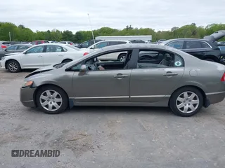 2006 Honda Civic LX z VIN 2HGFA165X6H525119, wystawiony jako IAAI lot #42314196 z przebiegiem 121 752 mil mil oraz . Historia ofert i sprzedaży dostępna na DreamBid. Obrazek 15.