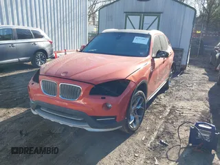 2015 BMW X1 xDrive28i with VIN WBAVL1C58FVY24900, listed as a IAAI auction lot 41772097 with 128,001 mi miles. Bid and sale history available at carsss.com. Image 2.