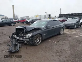 2015 BMW 7 Series 750i xDrive with VIN WBAYB6C59FD965820, listed as a IAAI auction lot 41558215 with 142,617 mi miles. Bid and sale history available at carsss.com. Image 2.