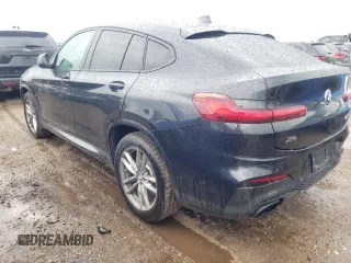 2021 BMW X4 M40i with VIN 5UX2V5C00M9H95699, listed as a Copart auction lot 63564433 with 33,500 mi miles and Salvage title. Bid and sale history available at DreamBid. Image 2.