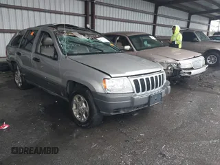 2001 Jeep Grand Cherokee Laredo with VIN 1J4GX48S51C708990, listed as a IAAI auction lot 41656323 with 198,124 mi miles and . Bid and sale history available at DreamBid. Image 1.