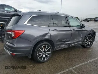 2020 Honda Pilot Touring 7-Passenger z VIN 5FNYF6H68LB052379, wystawiony jako Copart lot #57655775 z przebiegiem 73 501 mil mil oraz Szkoda całkowita • Salvage title. Historia ofert i sprzedaży dostępna na DreamBid. Obrazek 3.