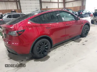 2024 Tesla Model Y Long Range with VIN 7SAYGAEE2RF986206, listed as a IAAI auction lot 42177852 with 14,399 mi miles and . Bid and sale history available at carsss.com. Image 4.