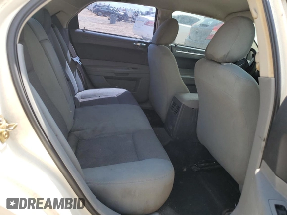 2005 Chrysler 300 300 z VIN 2C3JA43RX5H664428, wystawiony jako Copart lot #53851555 z przebiegiem Nie podano mil oraz Szkoda całkowita • Salvage title. Historia ofert i sprzedaży dostępna na DreamBid. Obrazek 10.
