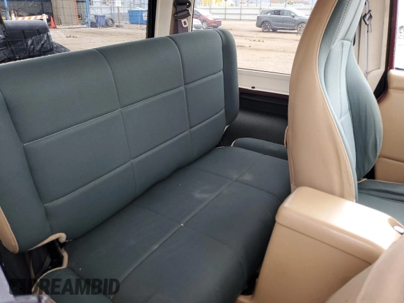 2002 Jeep Wrangler Sahara with VIN 1J4FA59S32P746410, listed as a Copart auction lot 56403075 with 147,968 mi miles and Salvage title. Bid and sale history available at DreamBid. Image 11.