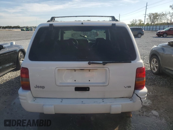 1998 Jeep Grand Cherokee Laredo with VIN 1J4GZ48Y9WC203024, listed as a Copart auction lot 83813114 with 105,044 mi miles and Non Repairable. Bid and sale history available at carsss.com. Image 6.