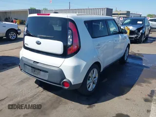 2014 Kia Soul + with VIN KNDJP3A58E7036528, listed as a IAAI auction lot 42014997 with 156,853 mi miles. Bid and sale history available at carsss.com. Image 4.