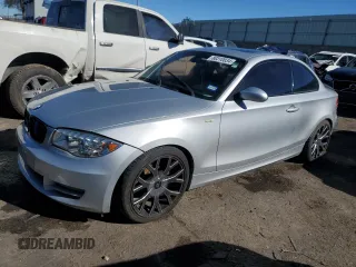 2009 BMW 1 Series 128i with VIN WBAUP93529VF48915, listed as a Copart auction lot 80310034 with 143,208 mi miles and Salvage title. Bid and sale history available at DreamBid. Image 1.