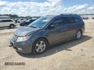 2012 Honda Odyssey Touring with VIN 5FNRL5H9XCB127410, listed as a Copart auction lot 56397565 with 147,824 mi miles and Salvage title. Bid and sale history available at DreamBid. Image 1.